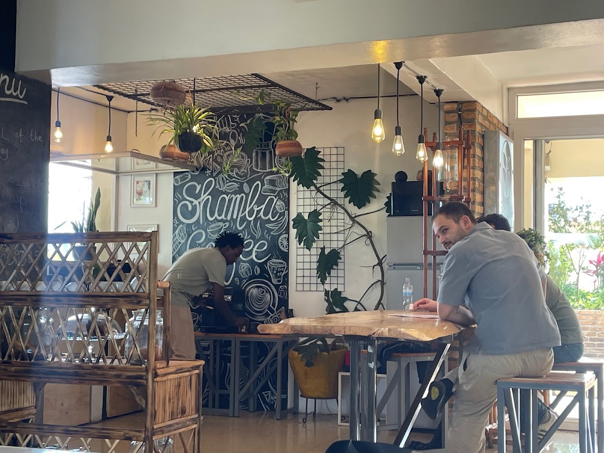 Shamba Speciality Coffee — the calmest specialty-coffee register in the city, an aesthetic adjacent to the Nyungwe canopy-walk visitor experience
