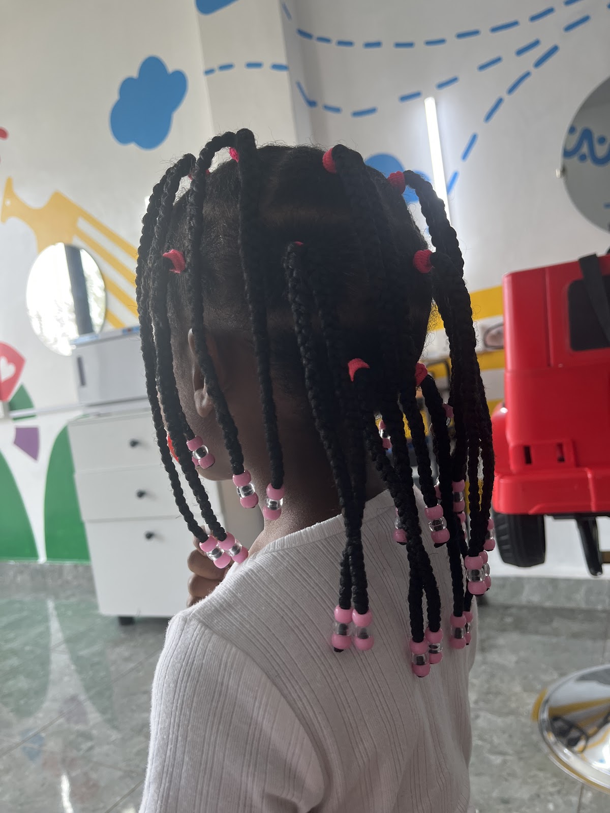 NIK Salon Kibagabaga — the working salon-network setting where Rwanda's salon-licensing regime plays out daily